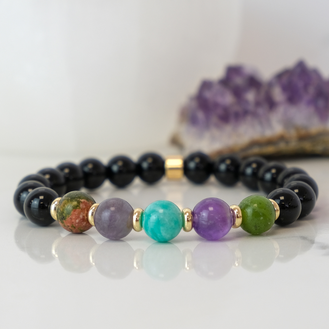 A Virgo zodiac gemstone bracelet with gold accessories