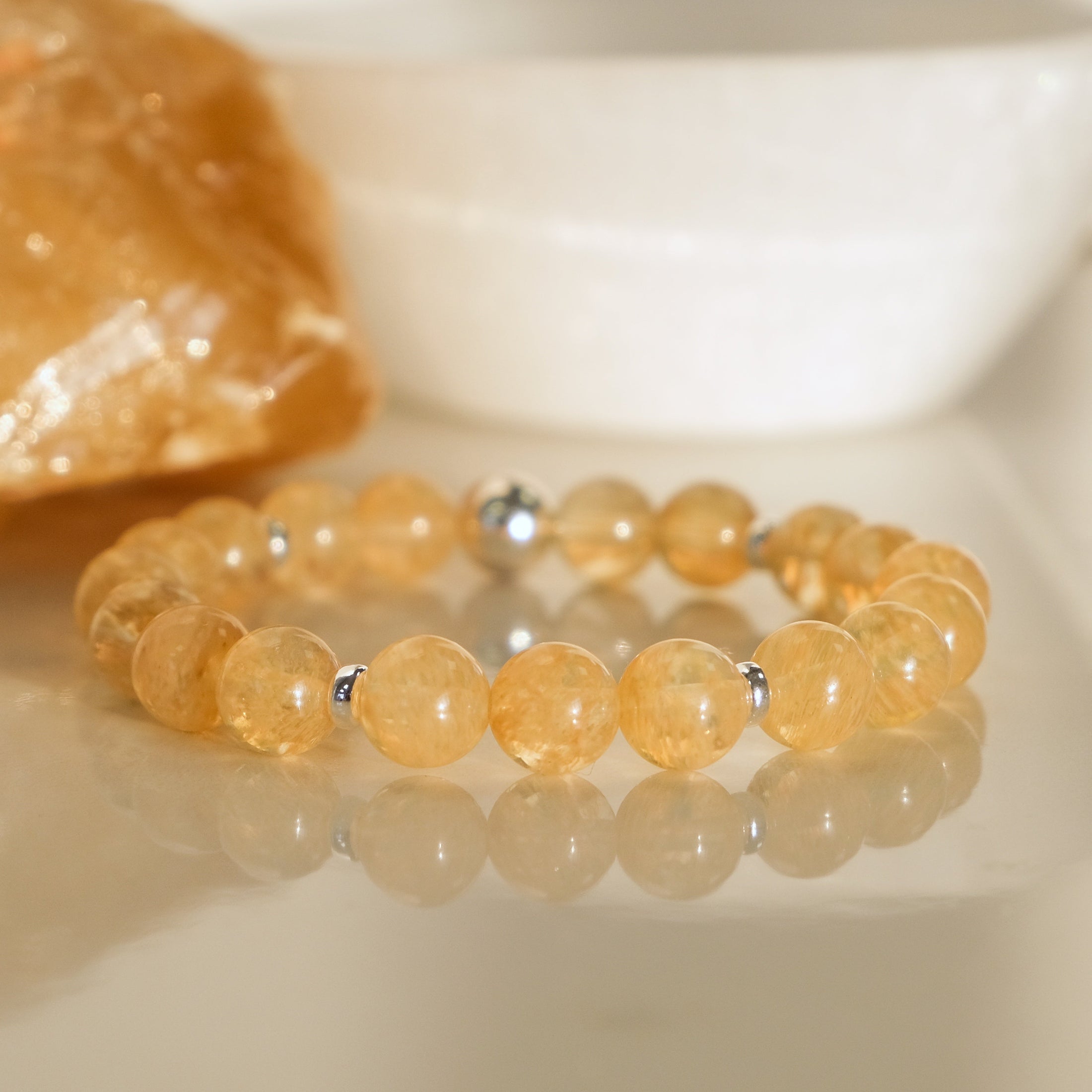 A golden healer quartz crystal bracelet to attract abundance