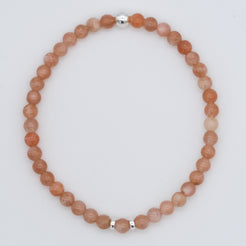 Sunstone gemstone bracelet in 4mm beads with silver accents from above 