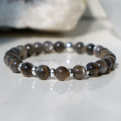 A black moonstone bracelet in 6mm beads with 925 sterling silver accessories