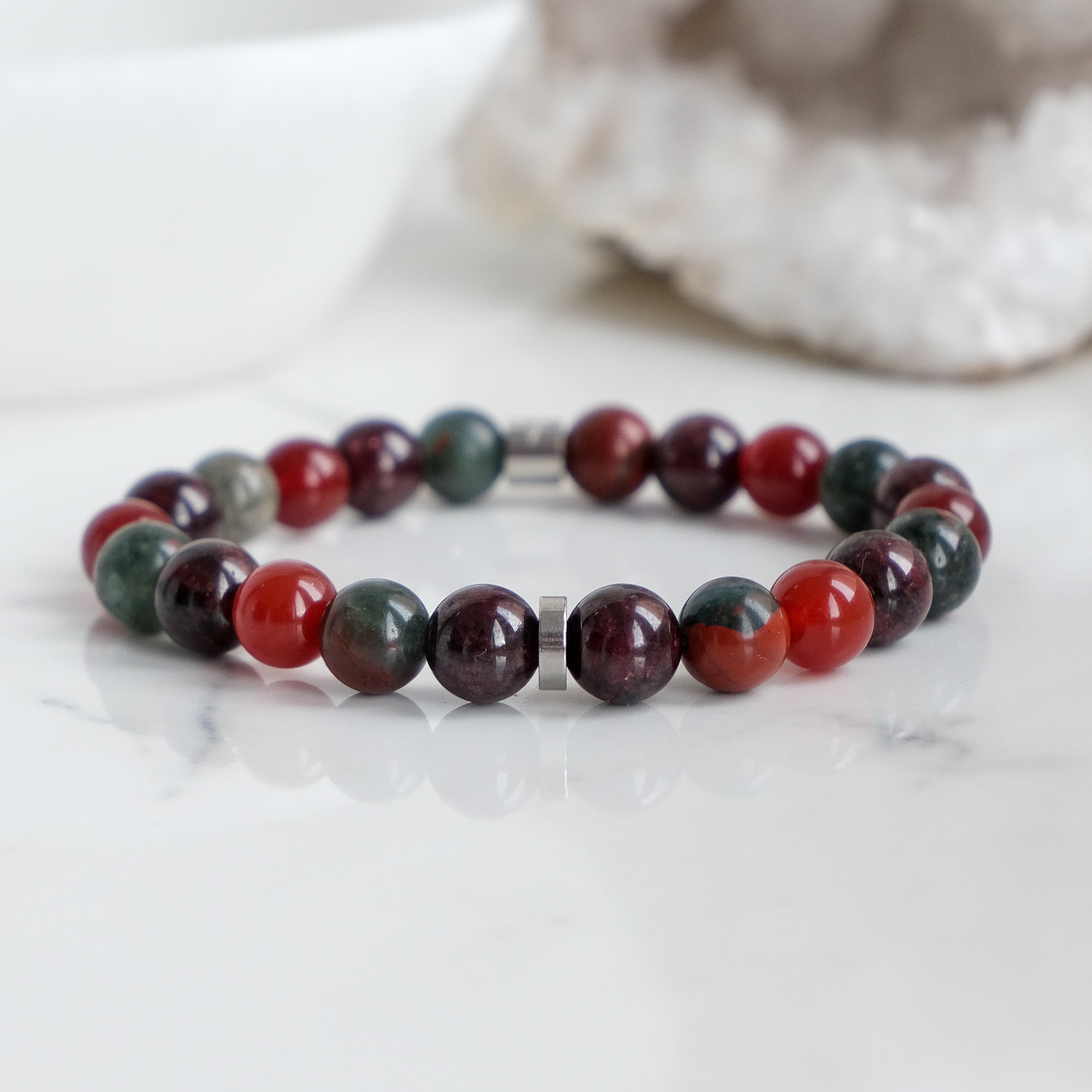 An 8mm garnet, carnelian and bloodstone gemstone bracelet with stainless steel accessories
