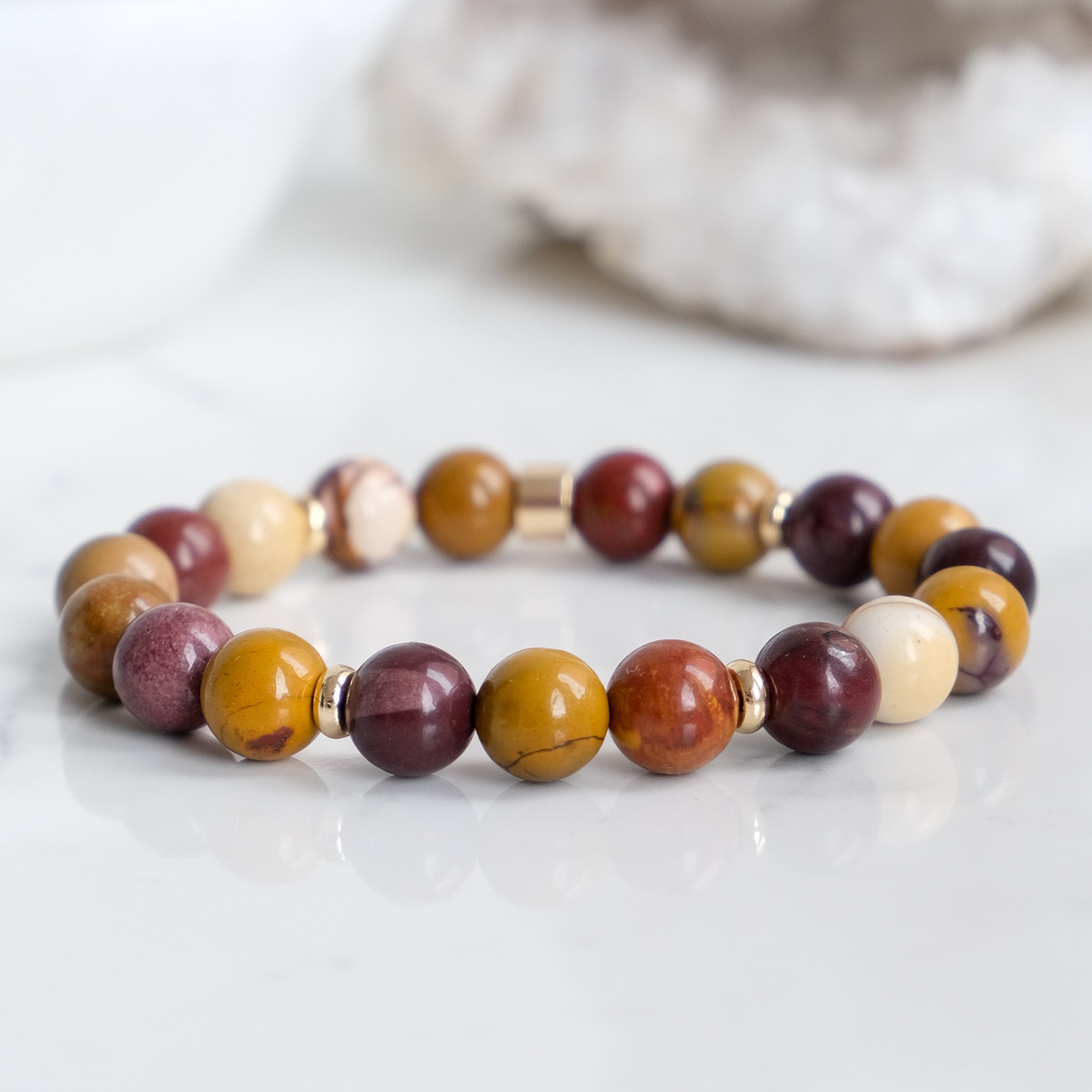 A Mookaite gemstone bracelet with 18ct gold plated accents