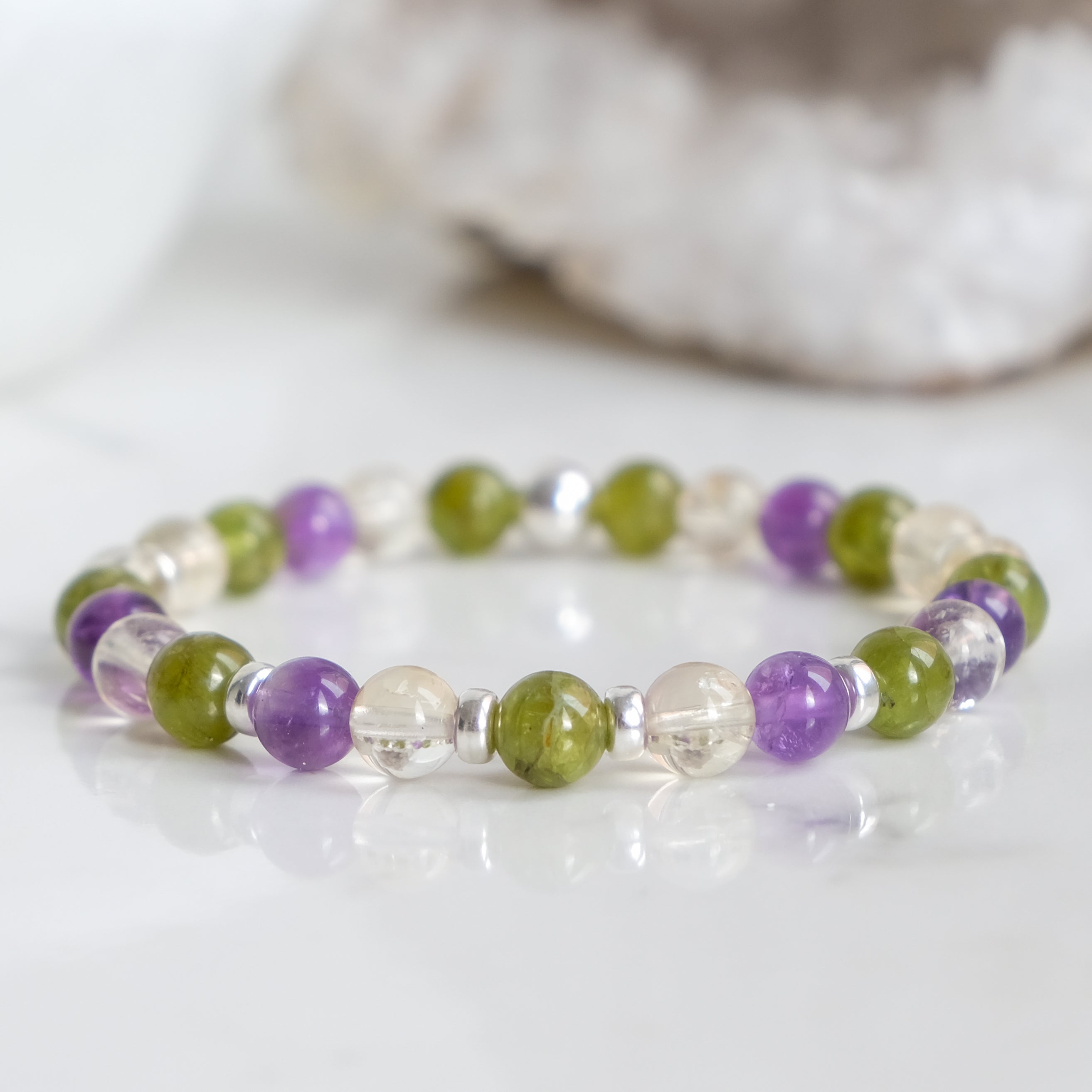 A 6mm peridot, amethyst and citrine gemstone bracelet with 925 sterling silver accessories