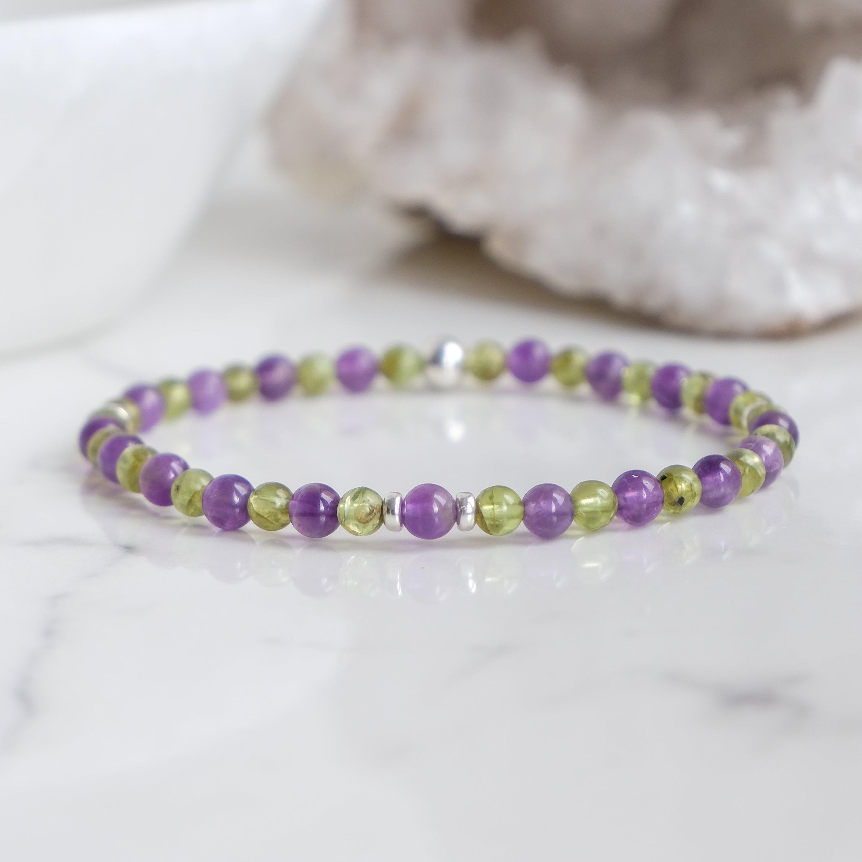 A 4mm peridot and amethyst gemstone bracelet with 925 sterling silver accessories