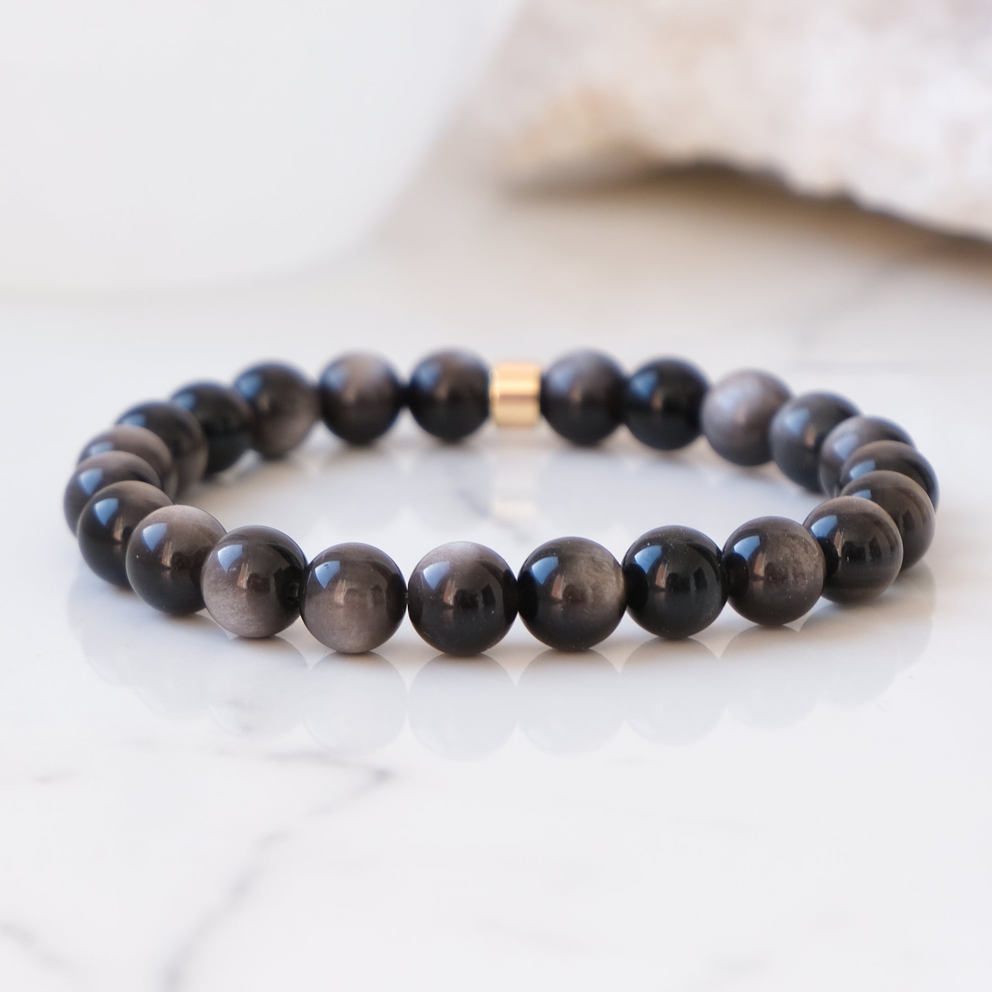 Silver sheen obsidian 8mm gemstone bracelet with gold accessory