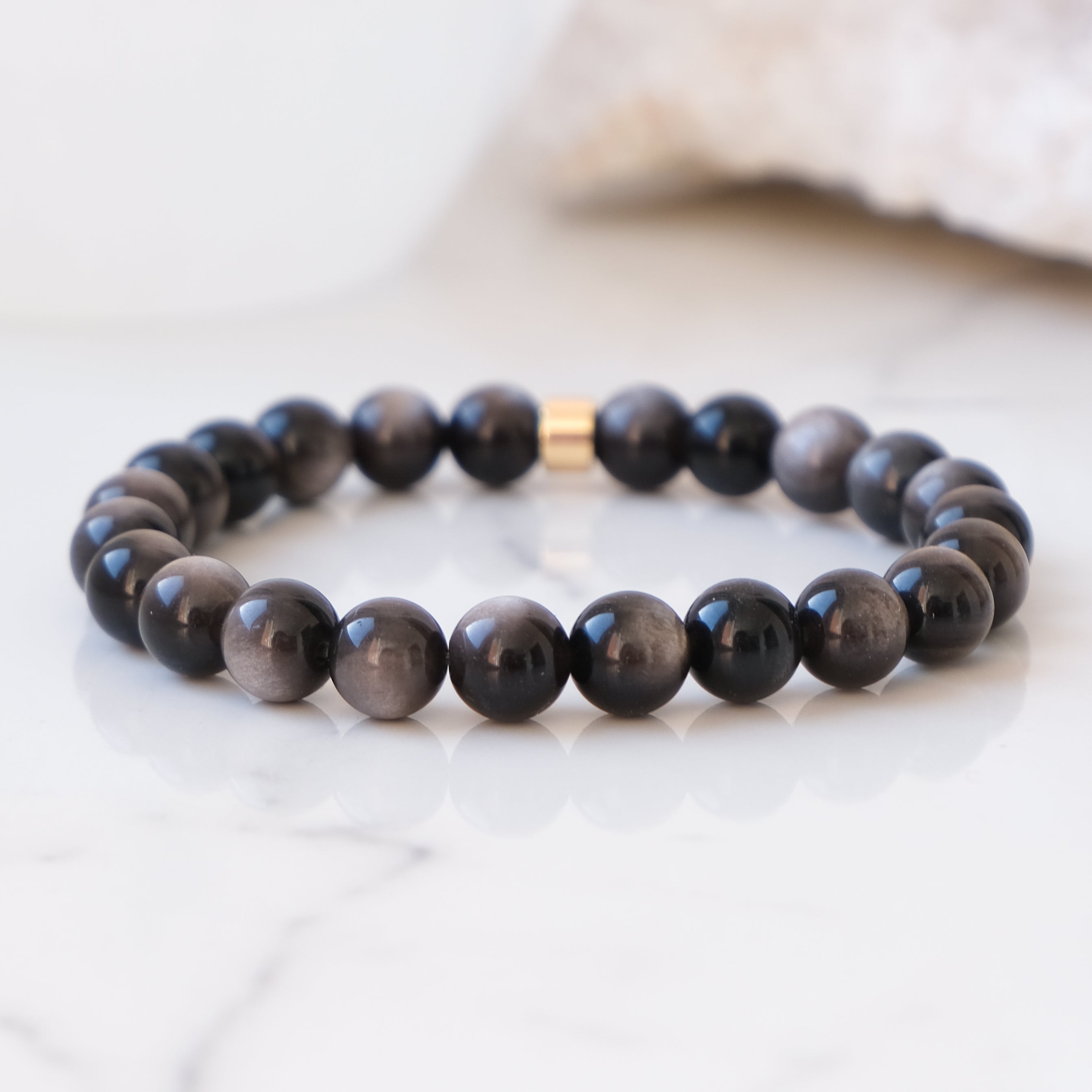 Silver sheen obsidian 8mm gemstone bracelet with gold accessory