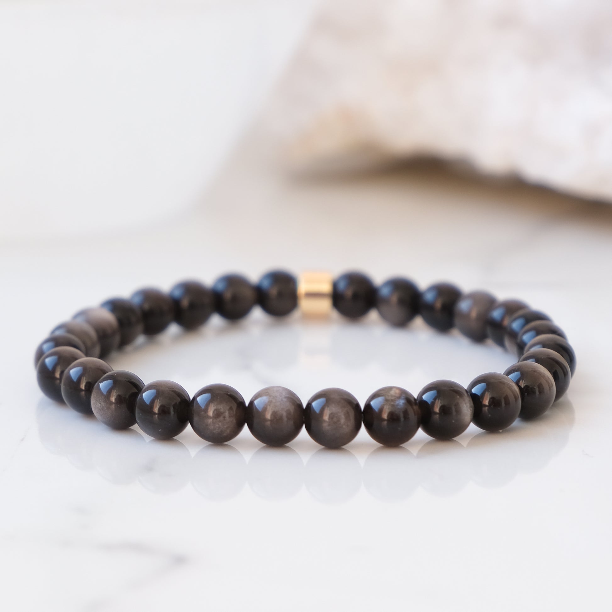 Silver sheen obsidian 6mm gemstone bracelet with gold accessory