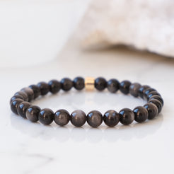 Silver sheen obsidian 6mm gemstone bracelet with gold accessory