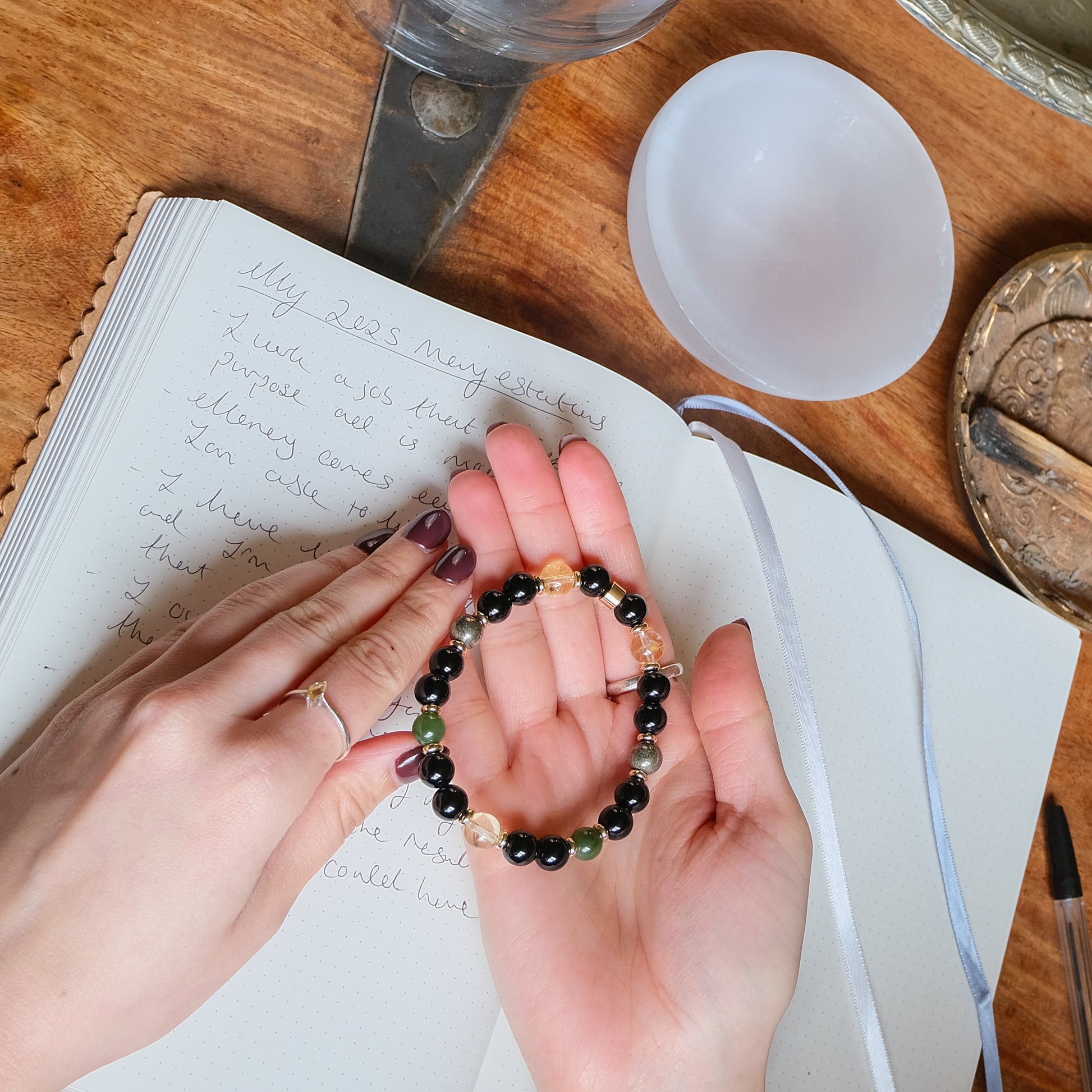 Writing your manifestations with the Samayla manifestation crystal bracelet