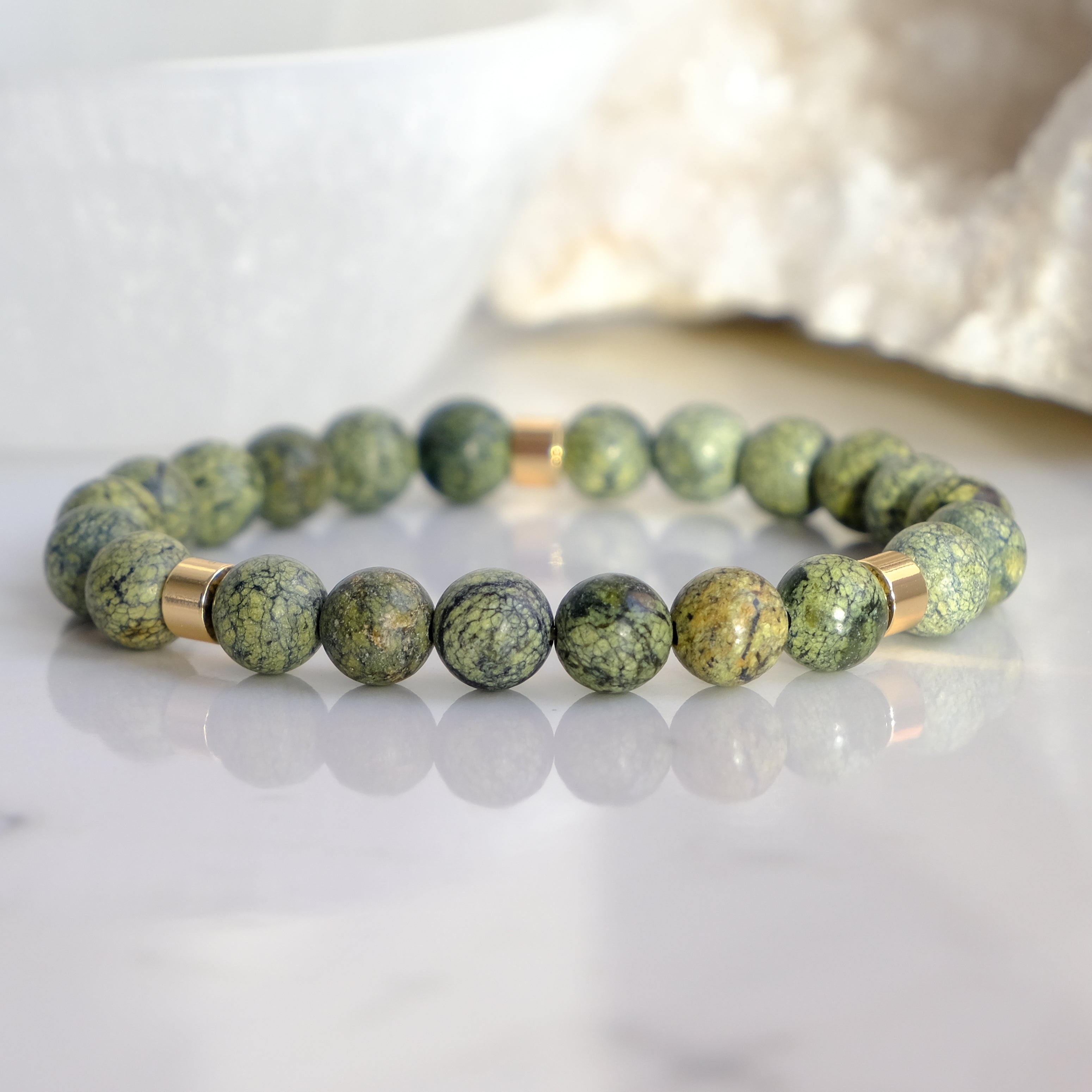 Serpentine gemstone bracelet with gold accessories