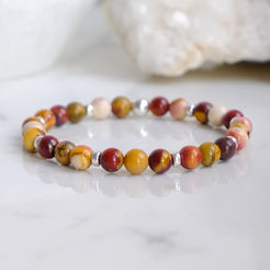 A 6mm mookaite gemstone bracelet with silver accessories