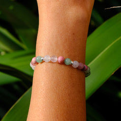 Heart healing gemstone bracelet worn on a model's wrist